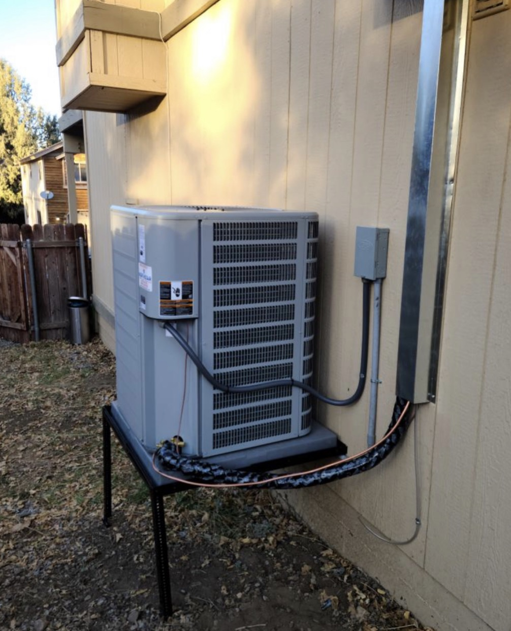 New air conditioning condenser install on a raised stand by Mario HVAC