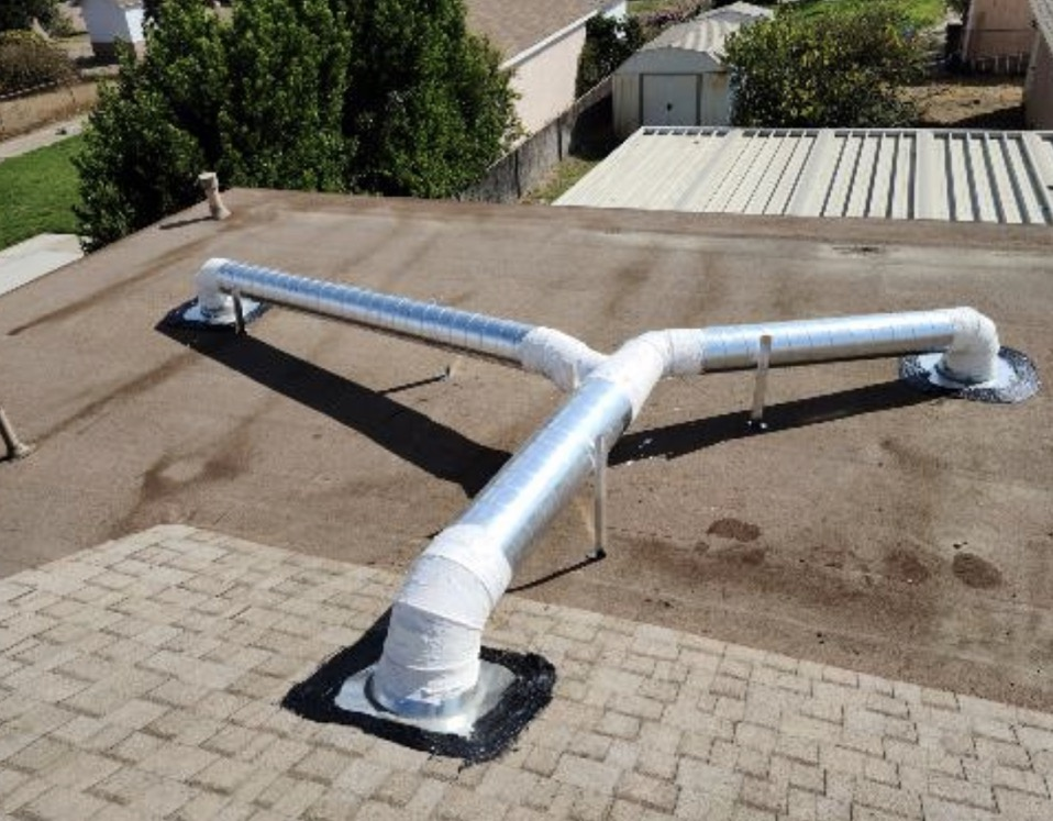 Custom rooftop ductwork installation with insulated trunk lines by Mario HVAC